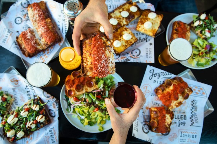 Slices of Detroit-style pizza on a serving tray